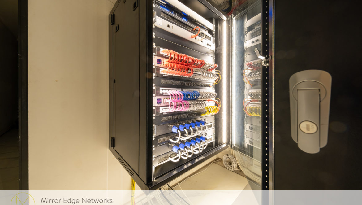 Organised network and AV racks in a Camps Bay Control4 server room