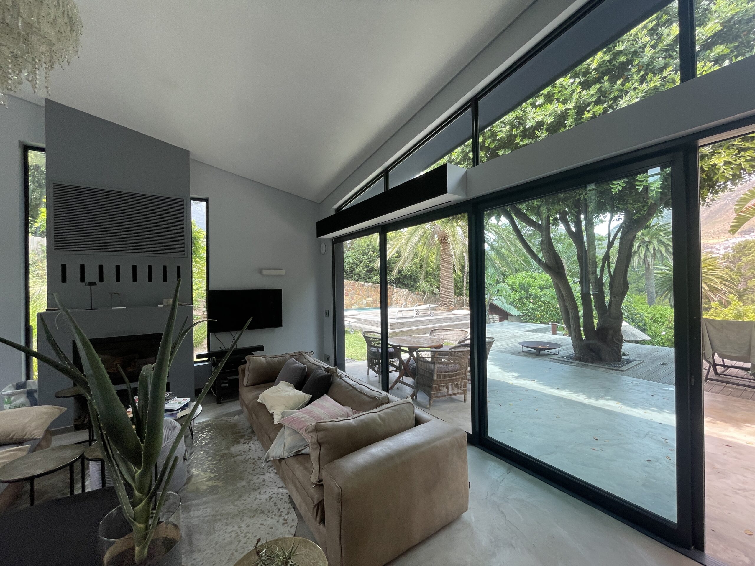 Hout Bay living room with the motorised cinema screen concealed