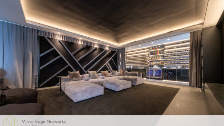 Oranjezicht home cinema with illuminated bar, custom seating and architectural lighting